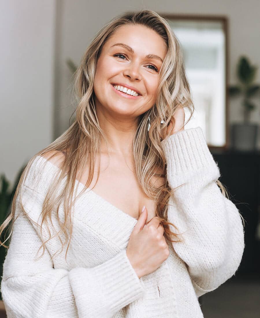 Mature woman in a white sweater