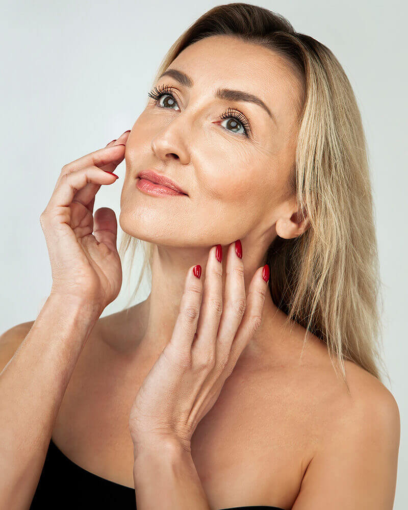 Mature woman with red nails